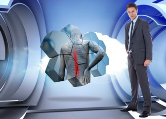 Poster - Composite image of serious businessman with hand on hip