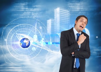 Poster - Composite image of thinking businessman holding pen