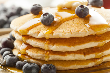 Wall Mural - Homemade Buttermilk Pancakes with Blueberries and Syrup