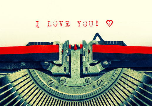 typewriter with sample text I LOVE YOU and heart
