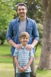 © WavebreakMediaMicro - Portrait of a father and boy at park