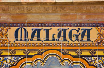 Canvas Print - Malaga sign over a mosaic wall