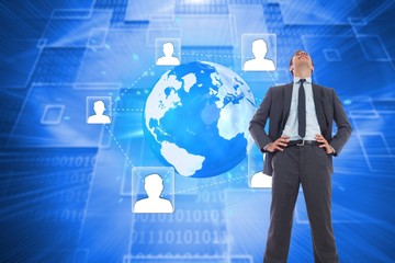 Poster - Composite image of happy businessman with hands on hips