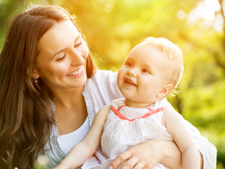 Beautiful Mother And Baby Outdoors. Nature