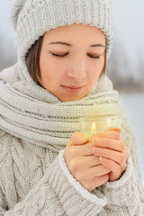 Poster - Portrait of happy woman with candle