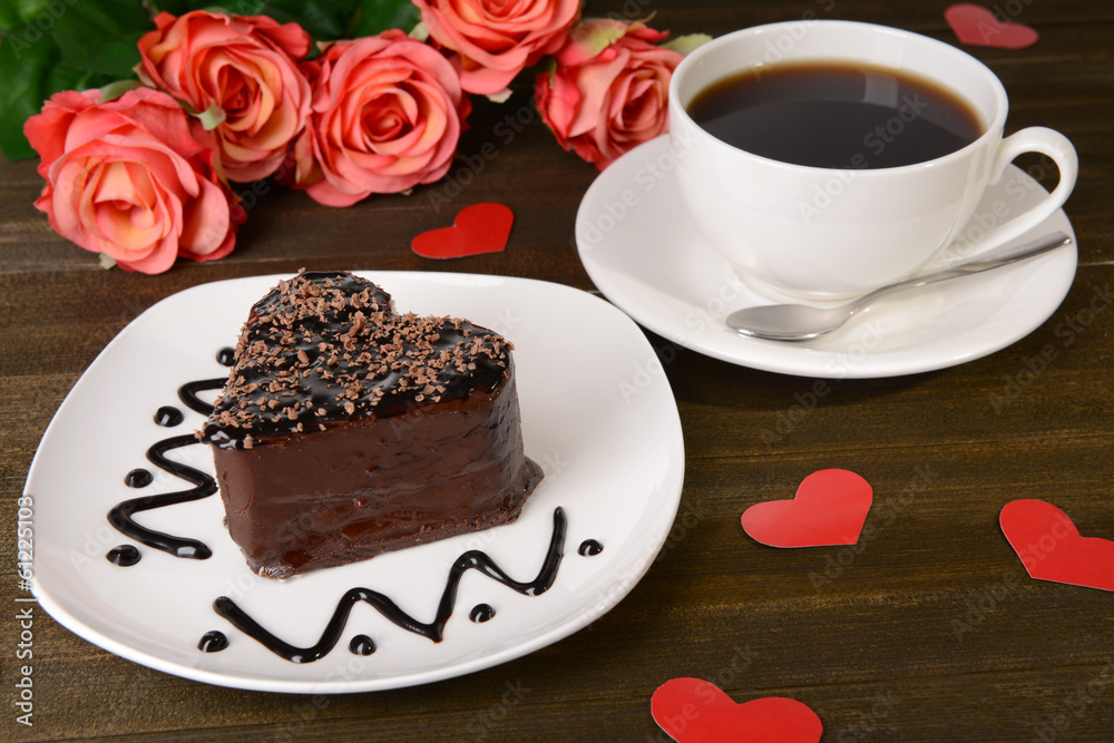 Sweet cake with chocolate on plate on table close-up