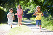 © Monkey Business - Three Asian Children Enjoying Walk In Countryside