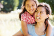 © Monkey Business - Portrait Of Asian Mother And Daughter In Countryside