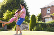 © Monkey Business - Asian Father And Daughter Playing In Summer Garden Together