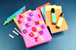 © Africa Studio - English alphabet, books and markers on school desk