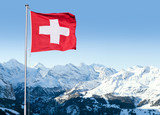 Fototapeta Big Ben - Swiss Flag Flying Over Alpine Scenery
