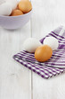 White and brown eggs on a linen napkin