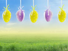 Five Hanging Easter Eggs On Sky Background