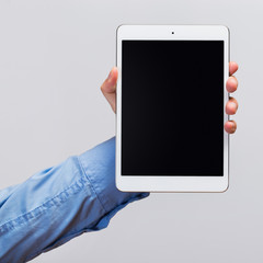 White tablet pc in hands