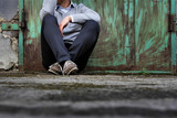 The man sitting on the ground