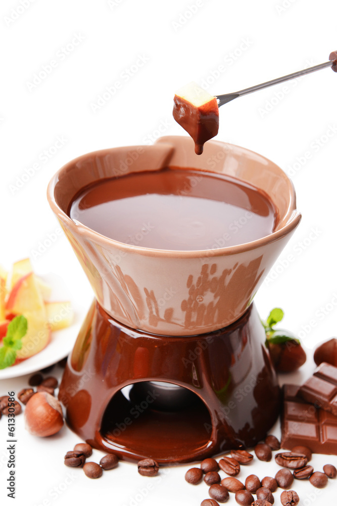 Chocolate fondue with fruits, isolated on white