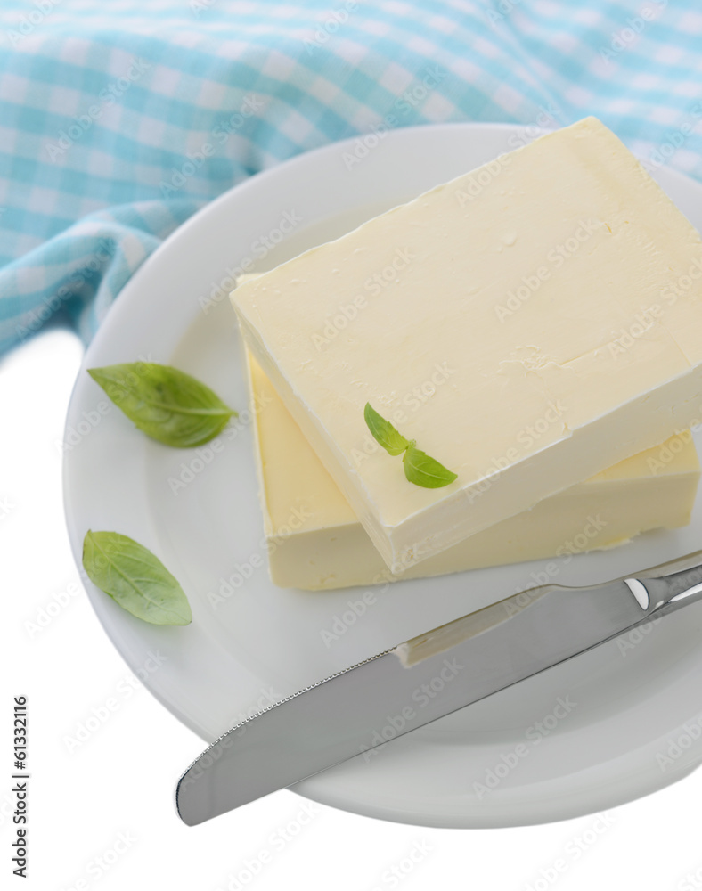 Tasty butter on plate, isolated on white
