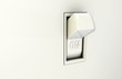 Isolated wall light switch in the On position
