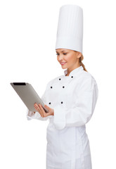 Poster - smiling female chef with tablet pc computer