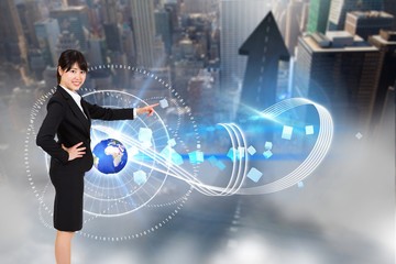Poster - Composite image of smiling businesswoman pointing