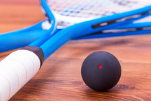 Close Up Of A Squash Rackets And Balls