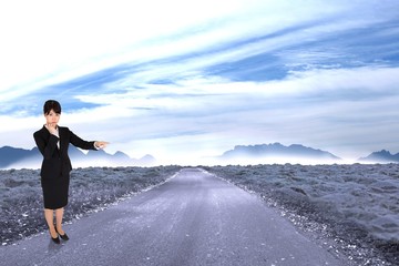 Poster - Composite image of businesswoman pointing