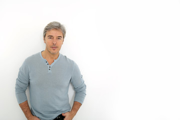 Wall Mural - Mature handsome man standing on white background