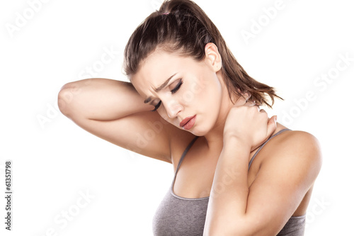 Fotografía beautiful young woman has a pain in the neck