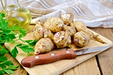 Poster - Jerusalem artichoke with a knife and oil on board