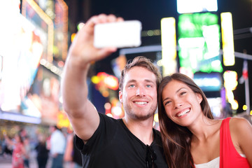 Wall Mural - Dating young couple happy in love taking selfie Manhattan, USA.