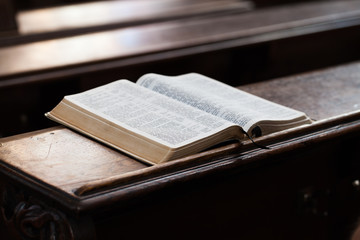 Wall Mural - Open Bible on a church bench