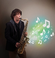 Young musician playing on saxophone while musical notes explodin