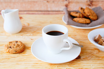 Wall Mural - coffee with cookies on the wooden background