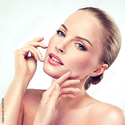 Fototapeta do kuchni Beautiful girl with clean and fresh skin, touching her face.