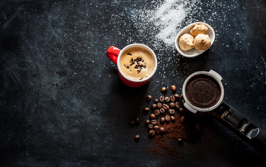 Espresso coffee and cookies on black cafe table