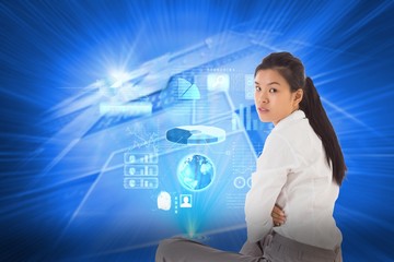 Poster - Composite image of businesswoman sitting cross legged frowning