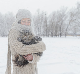 Poster - Woman with a cat outdoors