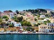 Colorful houses on hill, Symi island, Greece