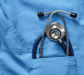 A stethoscope on a medical uniform, closeup