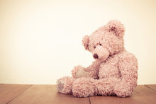 Retro Teddy Bear Toy Alone On Wooden Floor