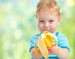 © Andrey Kuzmin - happy kid eating banana fruit. healthy food eating concept.