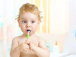 © Andrey Kuzmin - kid brushing teeth in bathroom