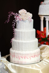 Wall Mural - White wedding cake decorated with pink flowers