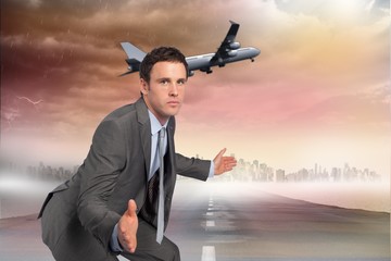 Poster - Composite image of businessman posing with hands out