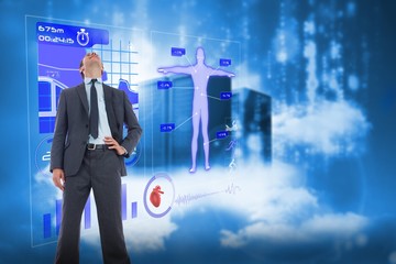 Poster - Composite image of happy businessman with hand on hip