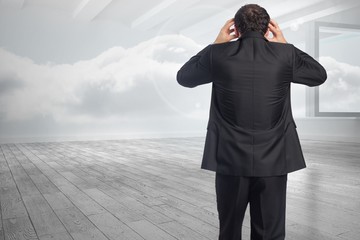 Poster - Composite image of stressed businessman with hands on head