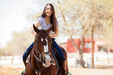 Beautiful Girl Riding A Horse