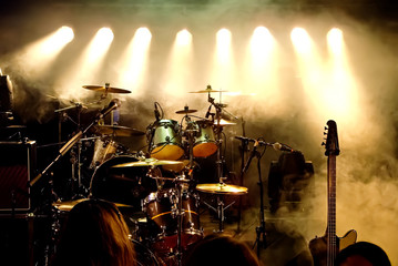 music instruments, drums/guitar on stage