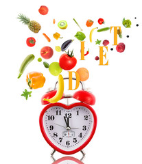 Wall Mural - Clock in shape of heart with fruits and vegetables.