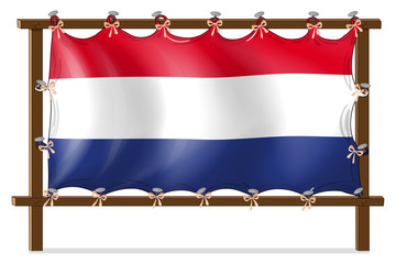 Wall Mural - The flag of Netherlands attached to the wooden frame